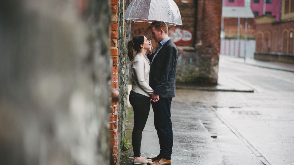 Barry & Gillian standing under an umbrella